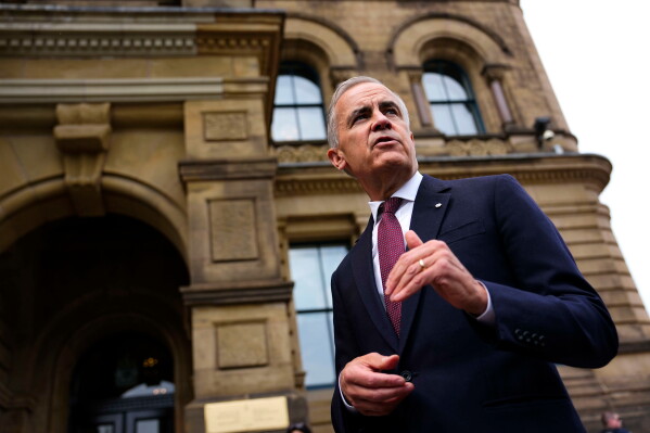 Canada Prime Minister Mark Carney makes a statement outside the Office of the Prime Minister and Privy Council in Ottawa, on Tuesday, July 21, 2026.(Justin Tang/The Canadian Press via AP)