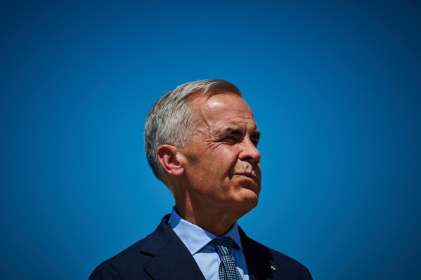 Prime Minister Mark Carney attends a housing announcement in Toronto, on Wednesday, Aug. 5, 2026. (Sammy Kogan/The Canadian Press via AP)