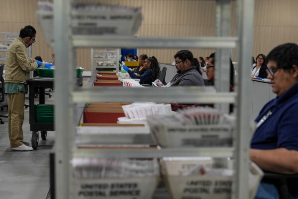 Ballots are inspected the day after California's primary election at the Los Angeles County Ballot Processing Center Wednesday, June 3, 2026, in City of Industry, Calif. (AP Photo/Jae C. Hong)