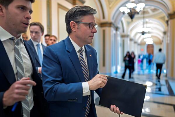 Speaker of the House Mike Johnson, R-La., leaves the chamber as members debate a series of measures including a continuing resolution to fund the government and a spending package for the Iran war, at the Capitol in Washington, Tuesday, July 21, 2026. (AP Photo/J. Scott Applewhite)