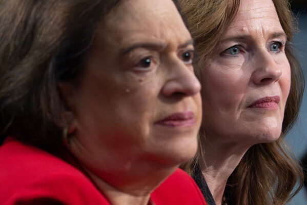 Supreme Court Justices Amy Coney Barrett, right, and Elena Kagan testify during a House Appropriations subcommittee hearing, Tuesday, July 14, 2026, on Capitol Hill in Washington. (AP Photo/Nathan Howard)