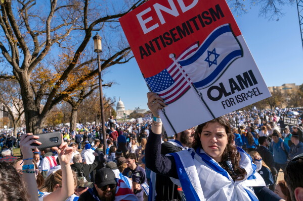 A woman holds a sign saying, "end antisemitism" while attending a March for Israel rally Nov. 14, 2023, on the National Mall in Washington. (AP Photo/Jacquelyn Martin, File)