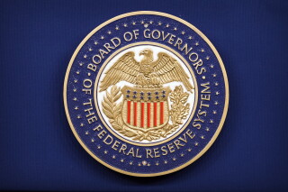 The logo of the Federal Reserve Board of Governors is seen before a news conference with Federal Reserve Board Chairman Kevin Warsh at the Federal Reserve in Washington, Wednesday, July 29, 2026. (AP Photo/Mark Schiefelbein)