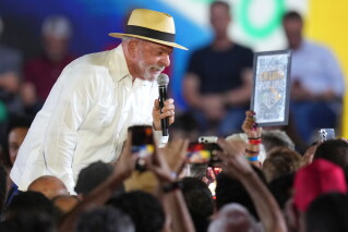 Brazilian President Luiz Inacio Lula da Silva speaks to supporters during the Workers' Party convention, where he was confirmed as the party's presidential candidate for the next election in Sao Paulo, Brazil, Sunday, Aug. 2, 2026. (AP Photo/Andre Penner)