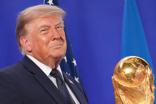 President Donald Trump listens as FIFA President Gianni Infantino speaks at a reception at Trump Tower in New York, Friday, July 17, 2026. (AP Photo/Jacquelyn Martin)