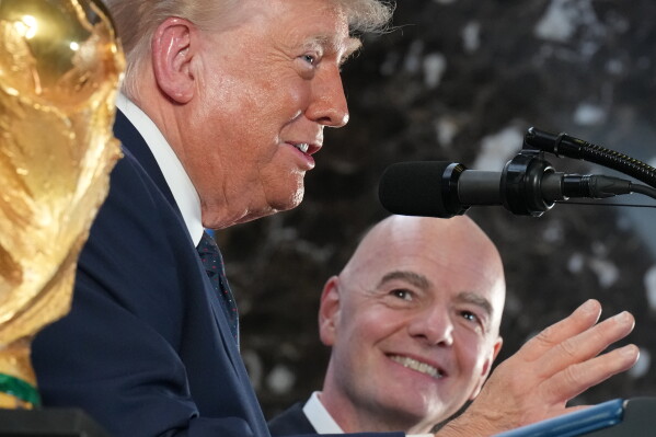 President Donald Trump speaks as FIFA President Gianni Infantino listens at a reception at Trump Tower in New York, Friday, July 17, 2026. (AP Photo/Jacquelyn Martin)