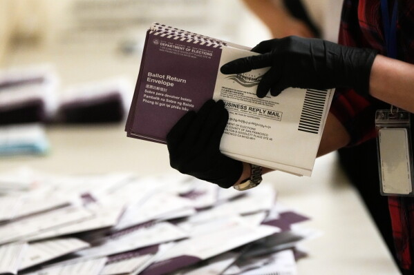 Department of Elections workers sort mail-in ballots for the California primary election at City Hall on Tuesday, June 2, 2026, in San Francisco. (AP Photo/Jeff Chiu, File)